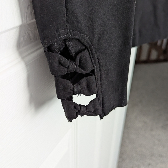 🔷Retrology Women's Black Pants With Open Bow Detailing At The Hem - Picture 3 of 6